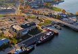 Aerial view of boats docked at the edge of town