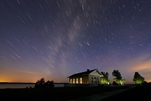 Lit up building under a starry night sky