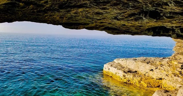 Looking out at the lake from inside a cave.