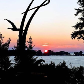 Silhouetted objects in the foreground with a sunset in the background