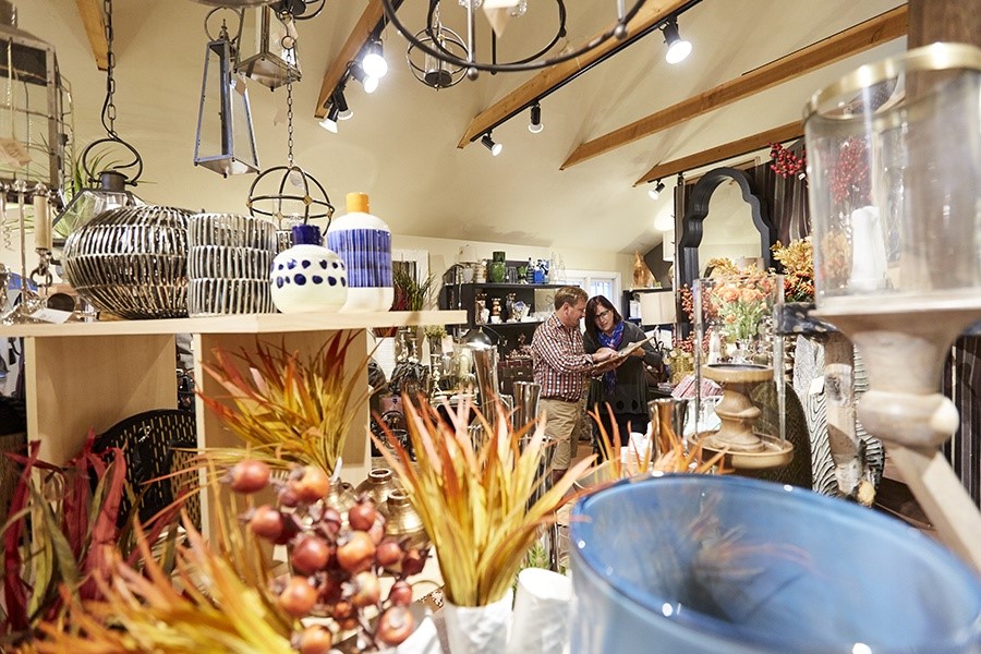 A man and woman shopping inside a store.