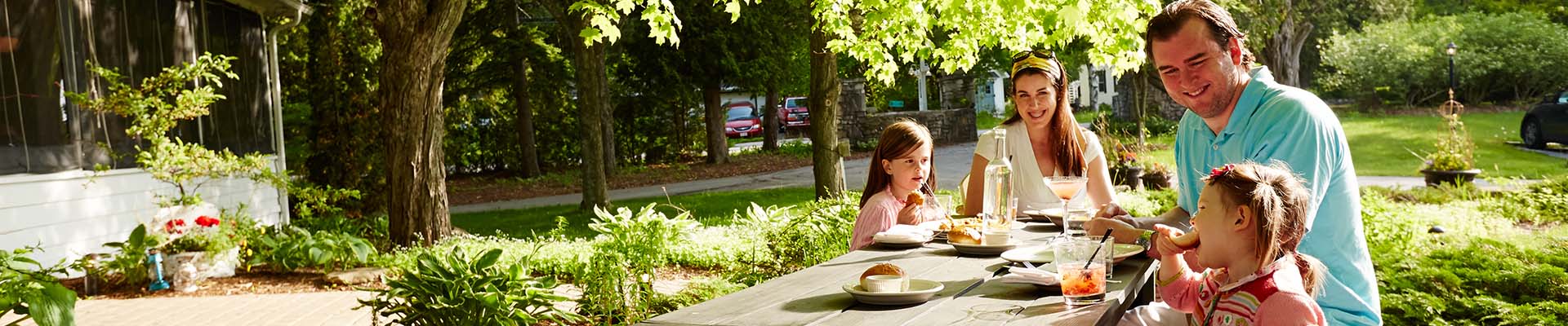 A family eating together at a picnic table