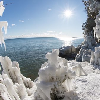 The ice-covered shoreline at the lake.