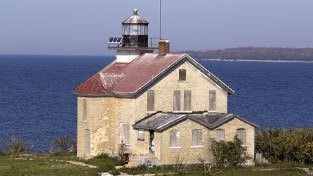 Lighthouse building on the edge of the lake